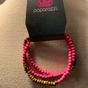Brown and Pink wooden bracelet stretchy material hyper allergenic.